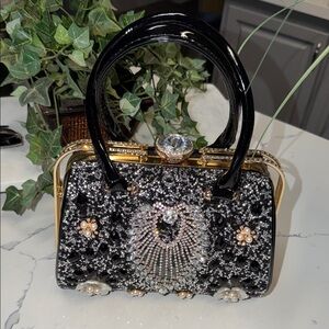 Elegant Black and Gold Embellished Handbag